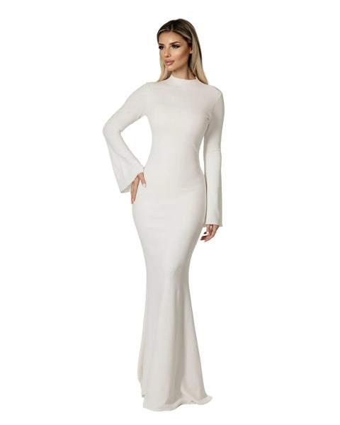Elegant model wearing the Serena Long Dress in a striking white color with bell sleeves.